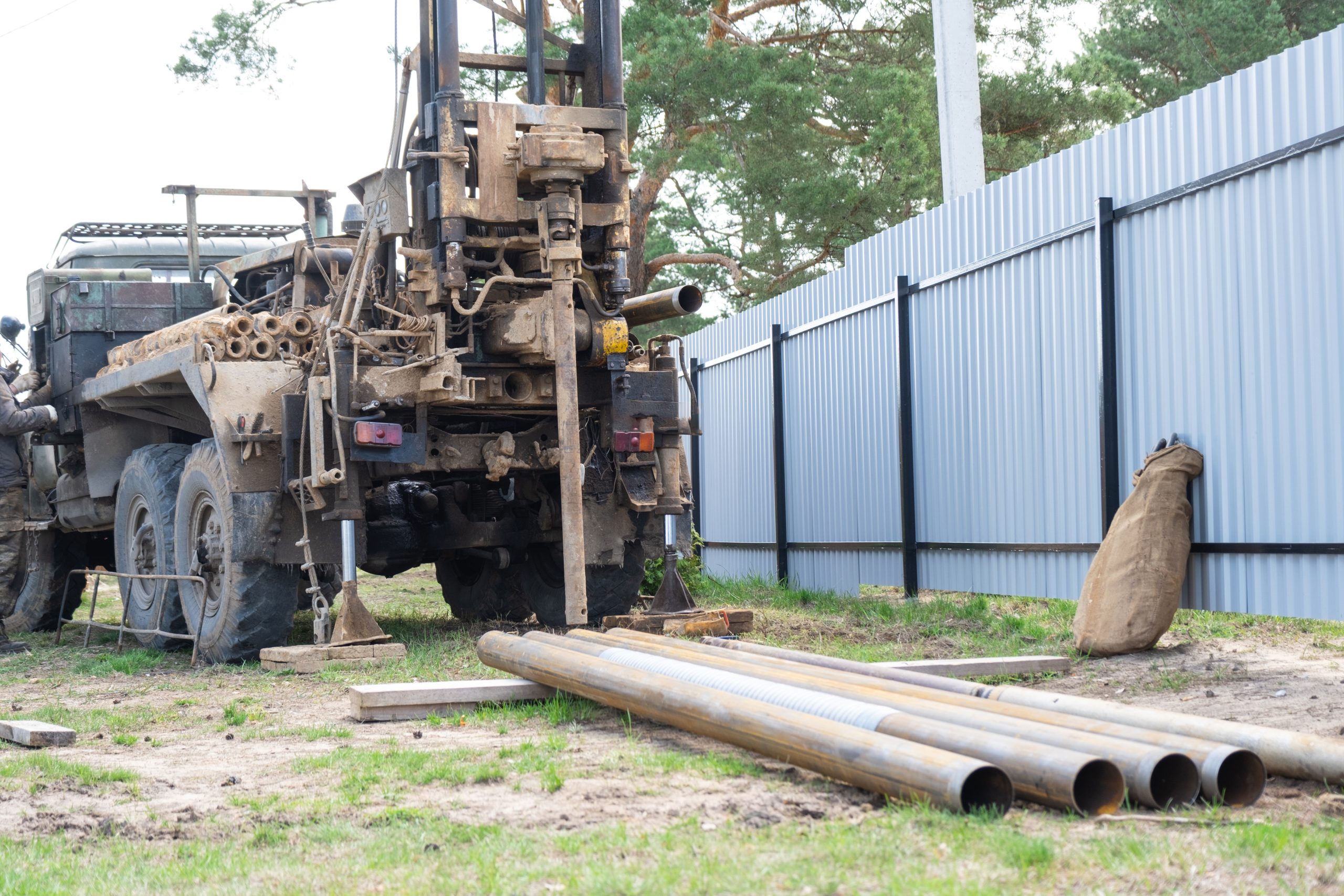 drilling rig on zil car are drilling artesian well for water in