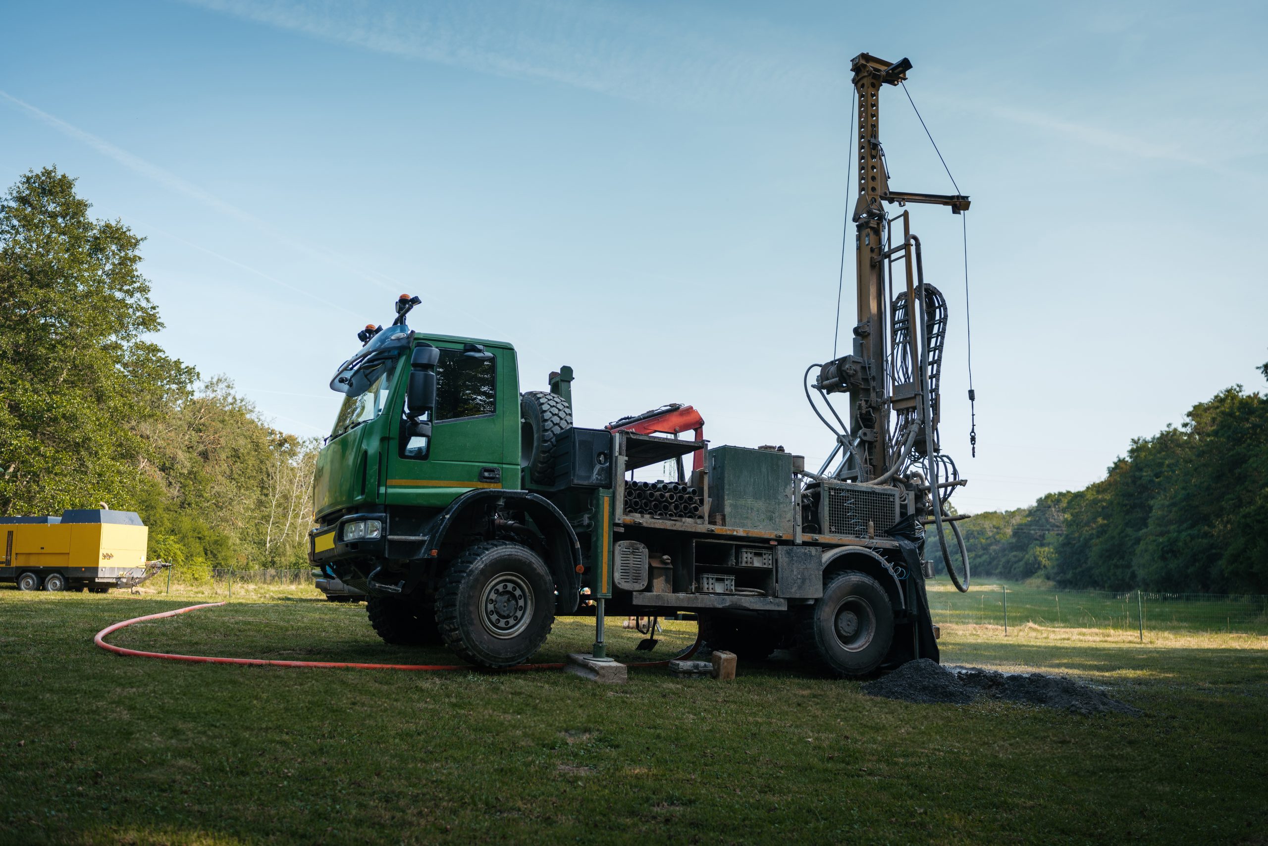 water well drilling rig preparing to boring dowin into the earth.