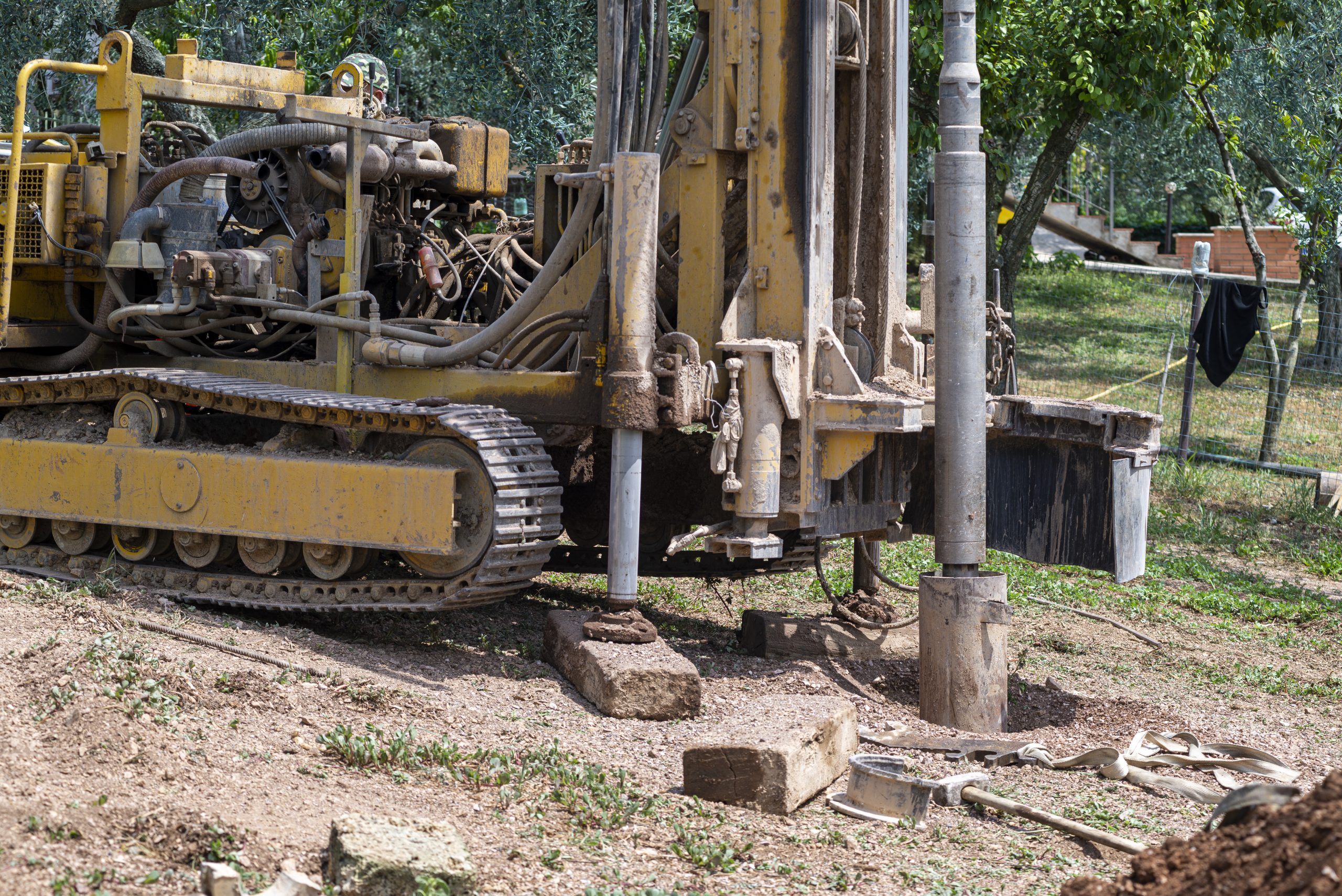 auger tractor digging the ground at a domestic construction site